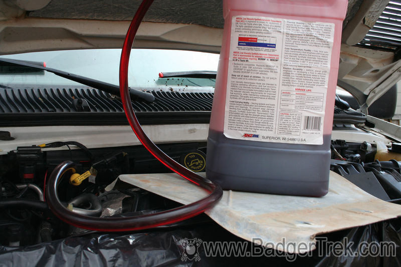 Siphoning transmission fluid into dipstick tube